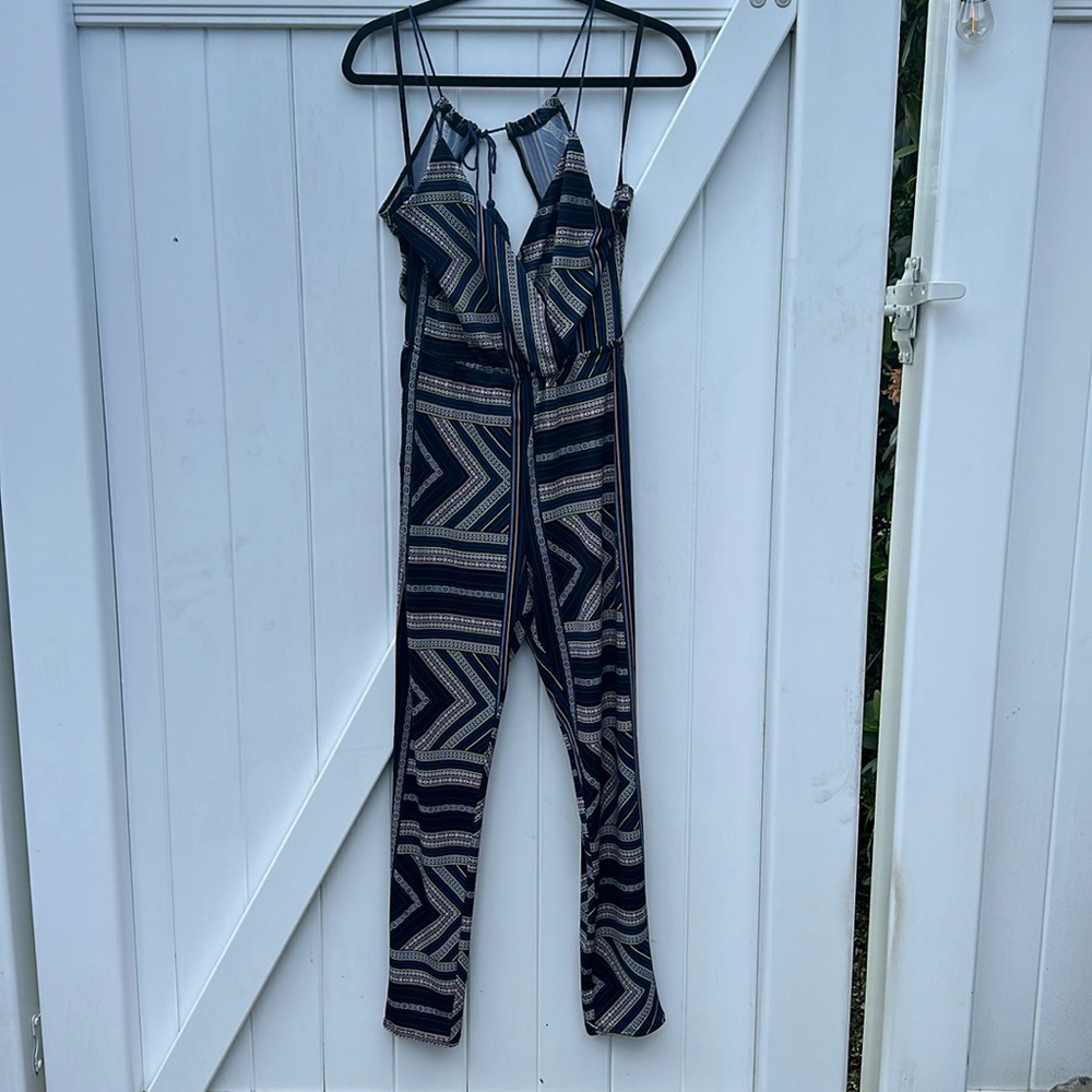 Stylish jumpsuit, adjustable straps, open bag, forgiving material, negotiable